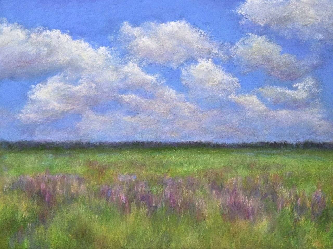 Pastel landscape of a green summer meadow with purple flowers beneath a bright blue sky filled with white clouds.